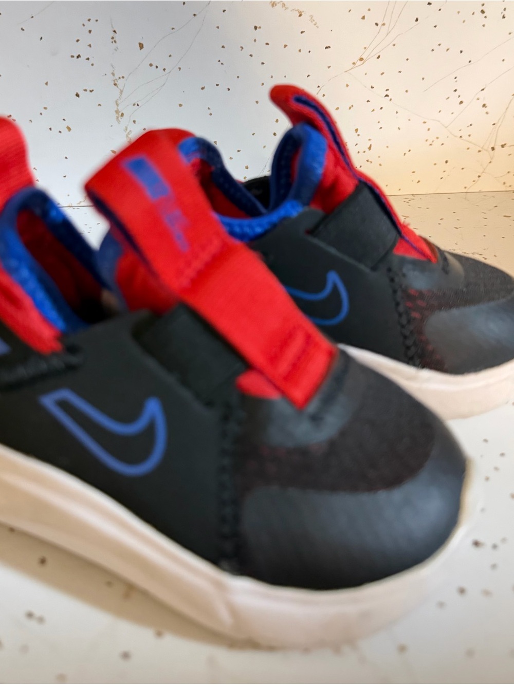 Nike Kids Black Sneaker with Red and Blue Details